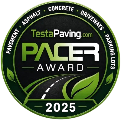 image_1-removebg-preview Circular “TestaPaving Pacer Award 2025” badge with road, leaf graphics, and green text accents.